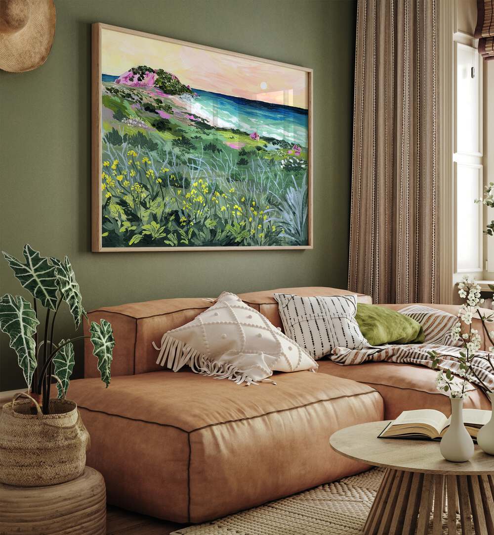 Sunset Rock By Sarah Gesek Landscape Art Prints in Oak Wood Plain Frame placed on a living room wall behind a sofa