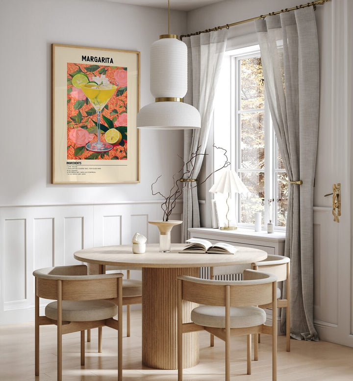 Sunshine Margarita Cafe Art Prints Cafe Posters in Oak Wood Plain Frame placed on a wall in a dining room area beside a window and behind a dining table