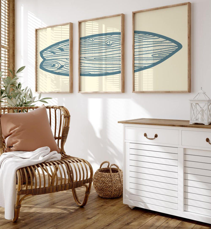 Surf Board Artworks Set Of 3 Paintings in Oak Wood Plain Frame placed on a wall beside a chair and a console