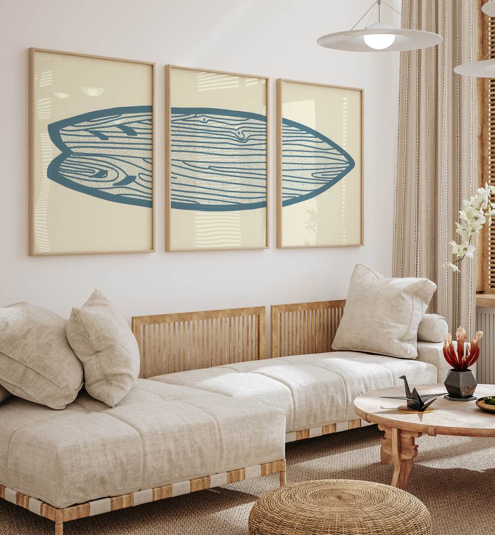 Surf Board Artworks Set Of 3 Paintings in Oak Wood Plain Frame placed on a wall living room wall behind a sofa