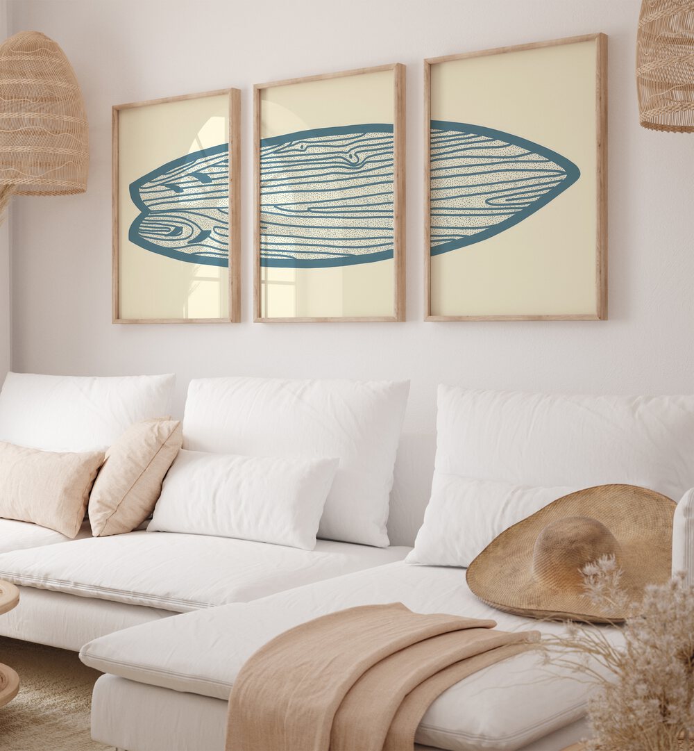 Surf Board Artworks Set Of 3 Paintings in Oak Wood Plain Frame placed on a wall living room wall behind a sofa