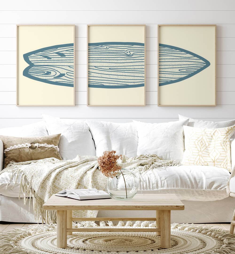 Surf Board Artworks Set Of 3 Paintings in Oak Wood Plain Frame placed on a wall living room wall behind a sofa