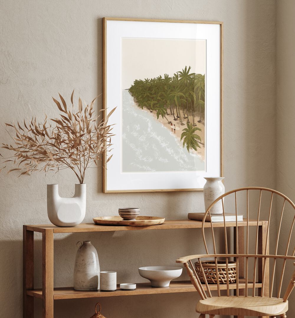 Surfers Paradise By Andi Bell Beach Prints in Oak Wood Frame With Mount on a cream wall placed above a table