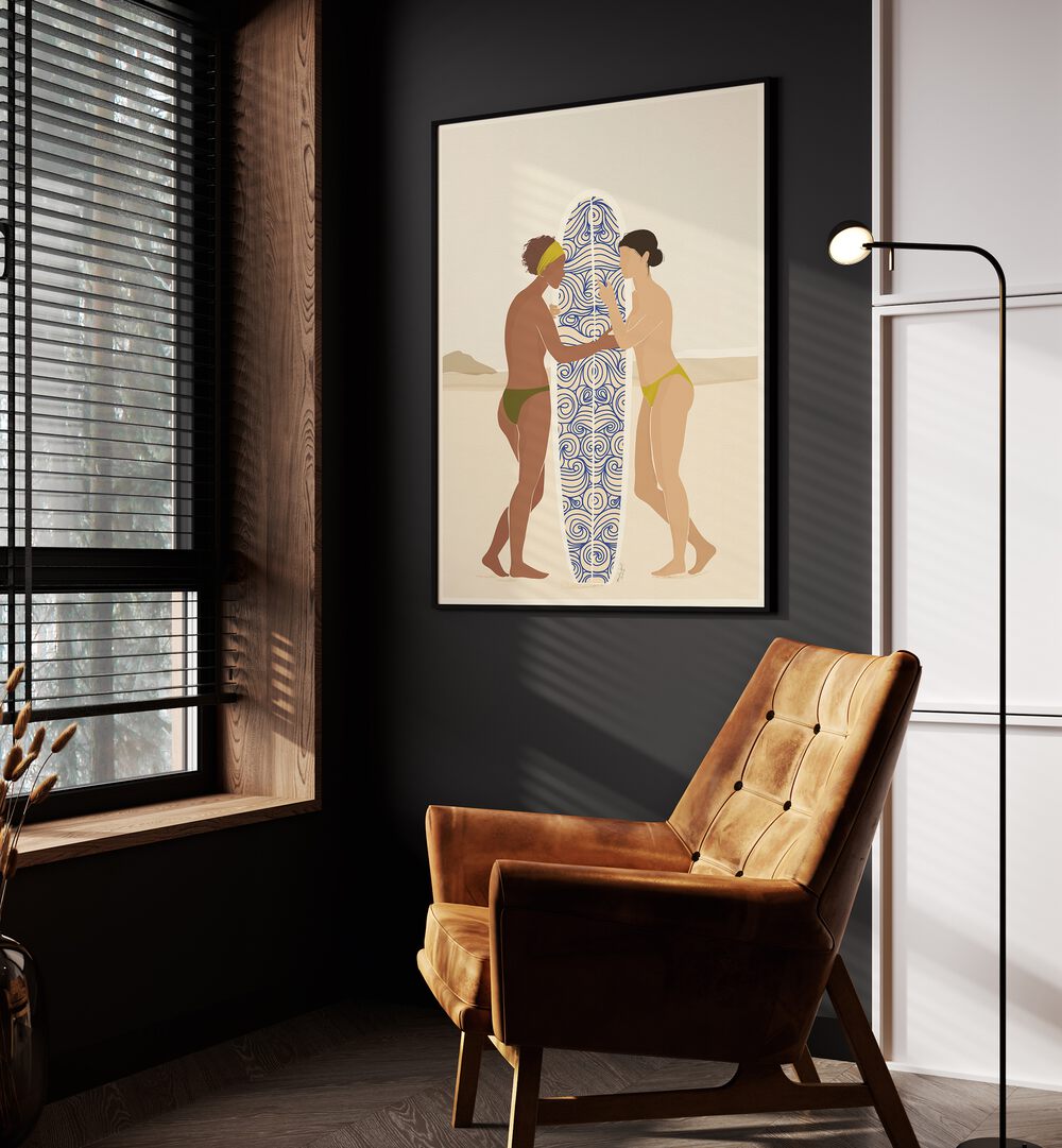 Surfing Connects People By Andi Bell Beach Prints in Black Plain Frame on a grey wall beside an orange sofa