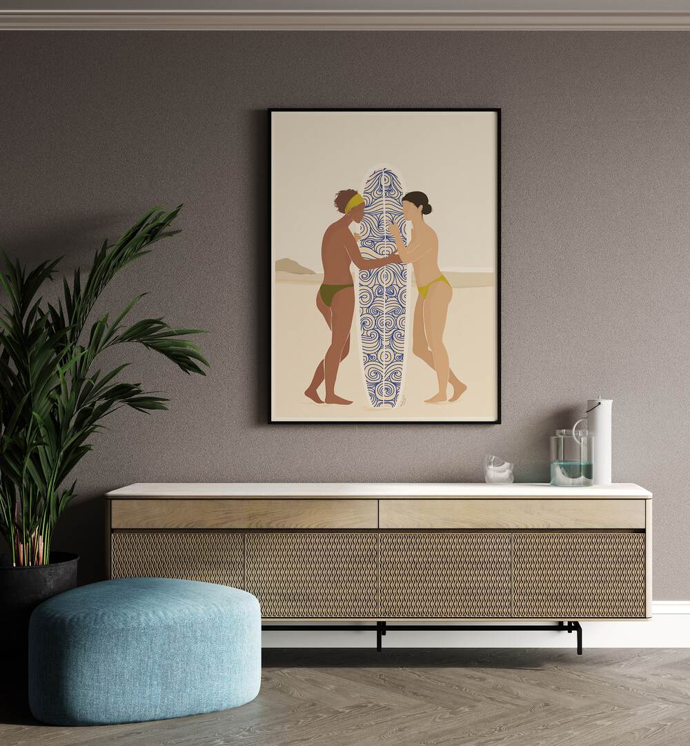 Surfing Connects People By Andi Bell Beach Prints in Black Plain Frame on a wall above a console table