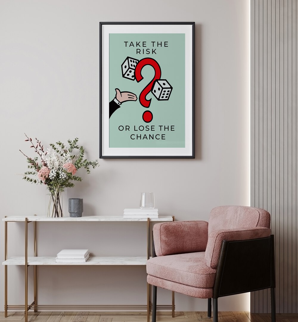 Take the Risk Money Art Artwork in black frame with mount hanging on wall above red chair