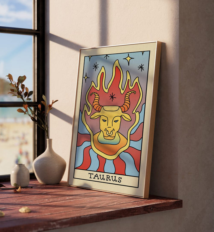 Taurus Zodiac & Tarot Art Painting Artwork in plain oakwood frame beside a window