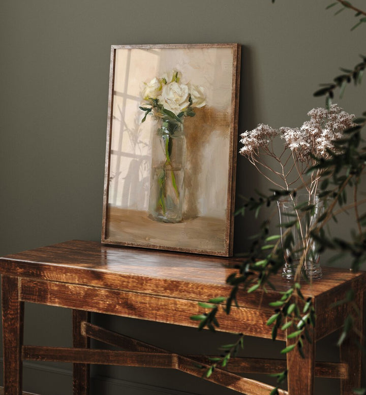 The Grace Of White Rose Vintage Art Painting Artwork in plain oakwood frame above a table beside a flower pot