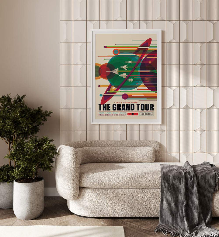 The Grand Tour Astronaut & Nasa Paintings, Space Art Prints Artwork in White Frame With Mount placed on a Beige Colored Tiled Wall near a Beige Sofa in the Living Room

 