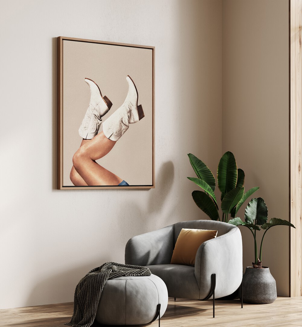 These Boots - Neutral Beige Surreal Art Painting Artwork in oakwood floater frame on a beige wall beside a sofa