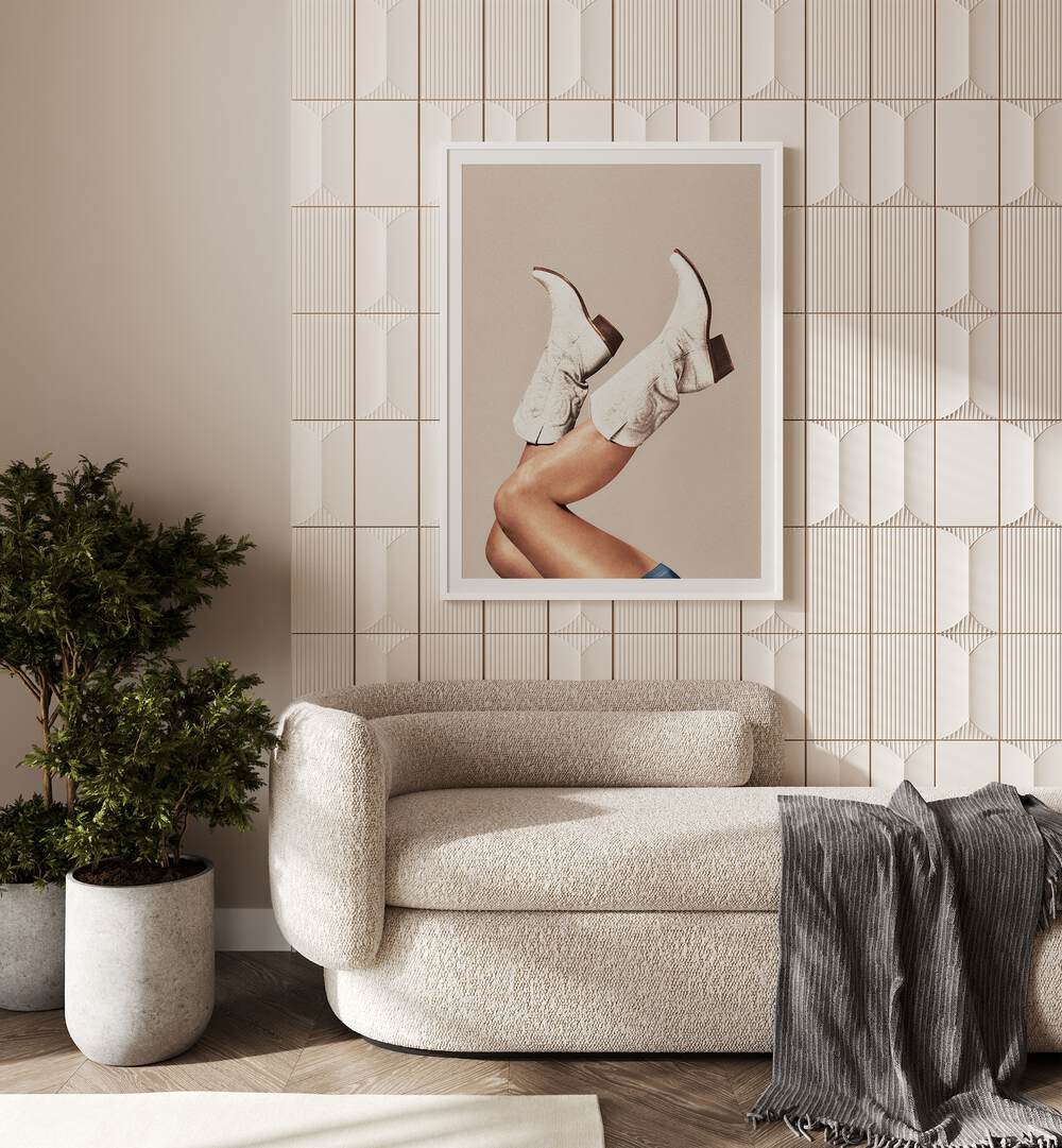 These Boots - Neutral Beige Surreal Art Painting Artwork in plain white frame behind a sofa beside a plant