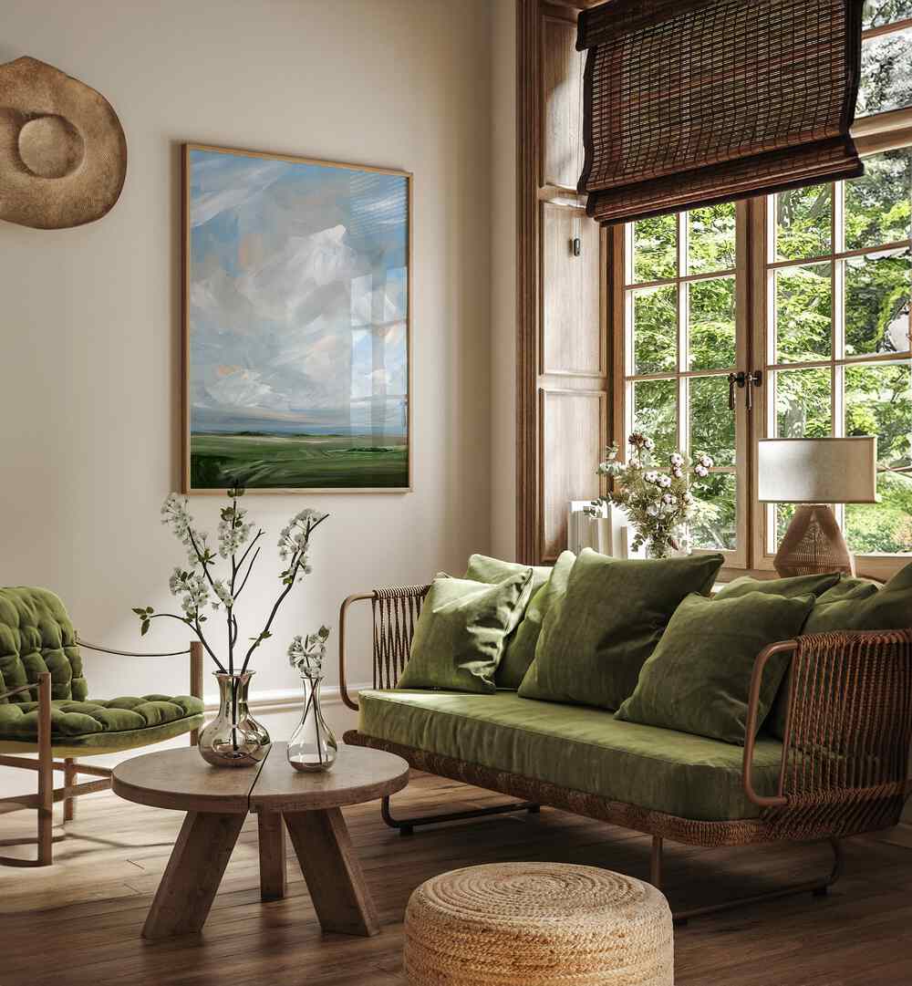 Explore "THIS LAND, ABSTRACT PAINTINGS" enhancing a stylish living room with modern decor and vibrant landscapes.