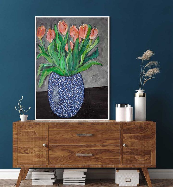 Vibrant tulips in a blue vase create a serene scene in TULIPS IN BLUE VASE I, FLORAL FLOWER PAINTINGS. Perfect for decor!