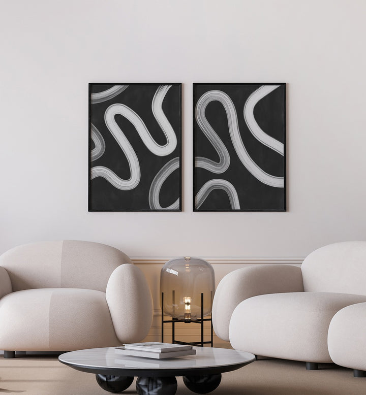 Enhance your decor with the TYPOGRAPHIC CHAOS SET, SET OF 2 PAINTINGS, featuring bold designs on stylish walls.