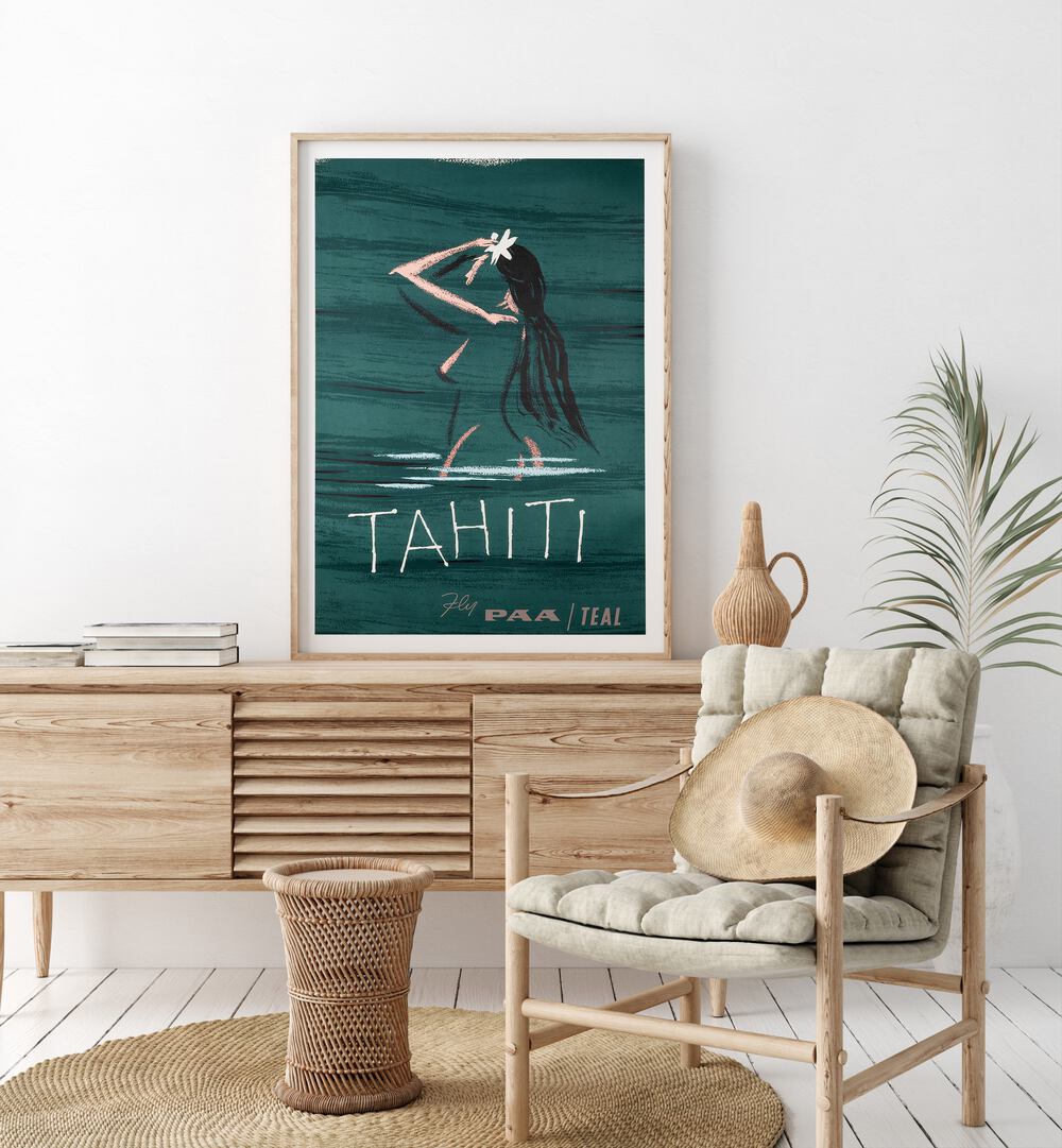 Tahiti  Retro Travel Posters in Oak Wood Plain Frame placed on a console table behind a chair