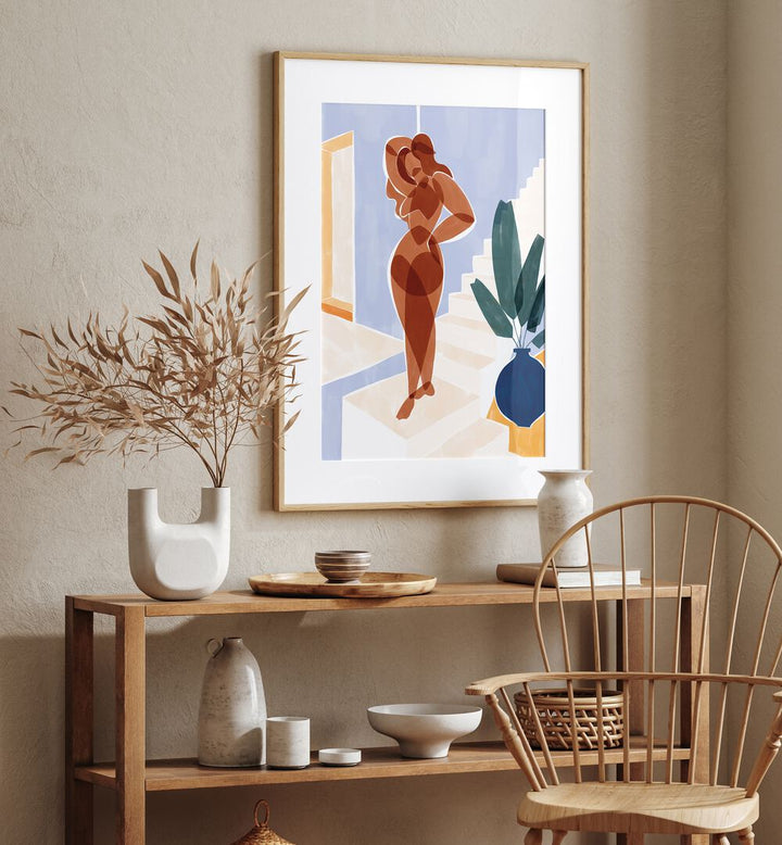 Terracotta Woman By Ivy Green Women Illustration Paintings in Oak Wood Frame With Mount on a cream wall above a table