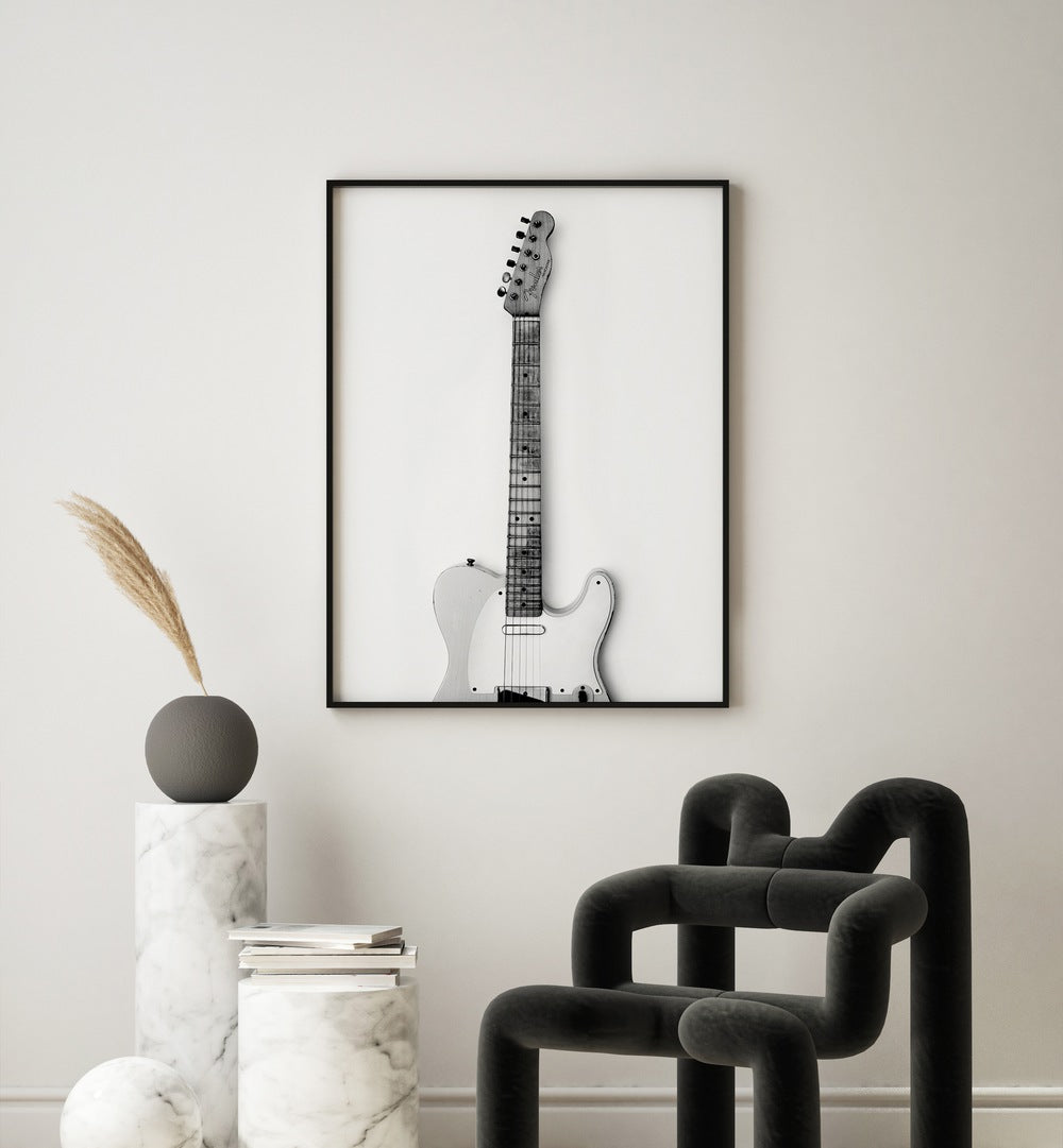 Thang Love by David Drake Fine Art Photography Fashion Photography in Black Plain Frame placed on a white wall behind marble tables and a art piece