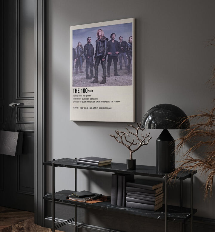 The 100 2014 I Movie Posters in Gallery Wrap placed on a wall behind a table and beside a door