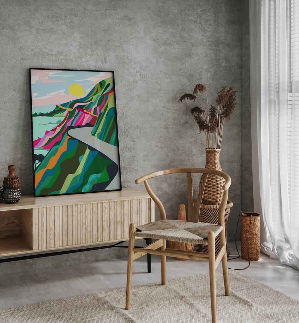 The Best Is Yet To Come By Uma Gokhale Landscape Art Prints in Black Plain Frame on a console table beside a plant