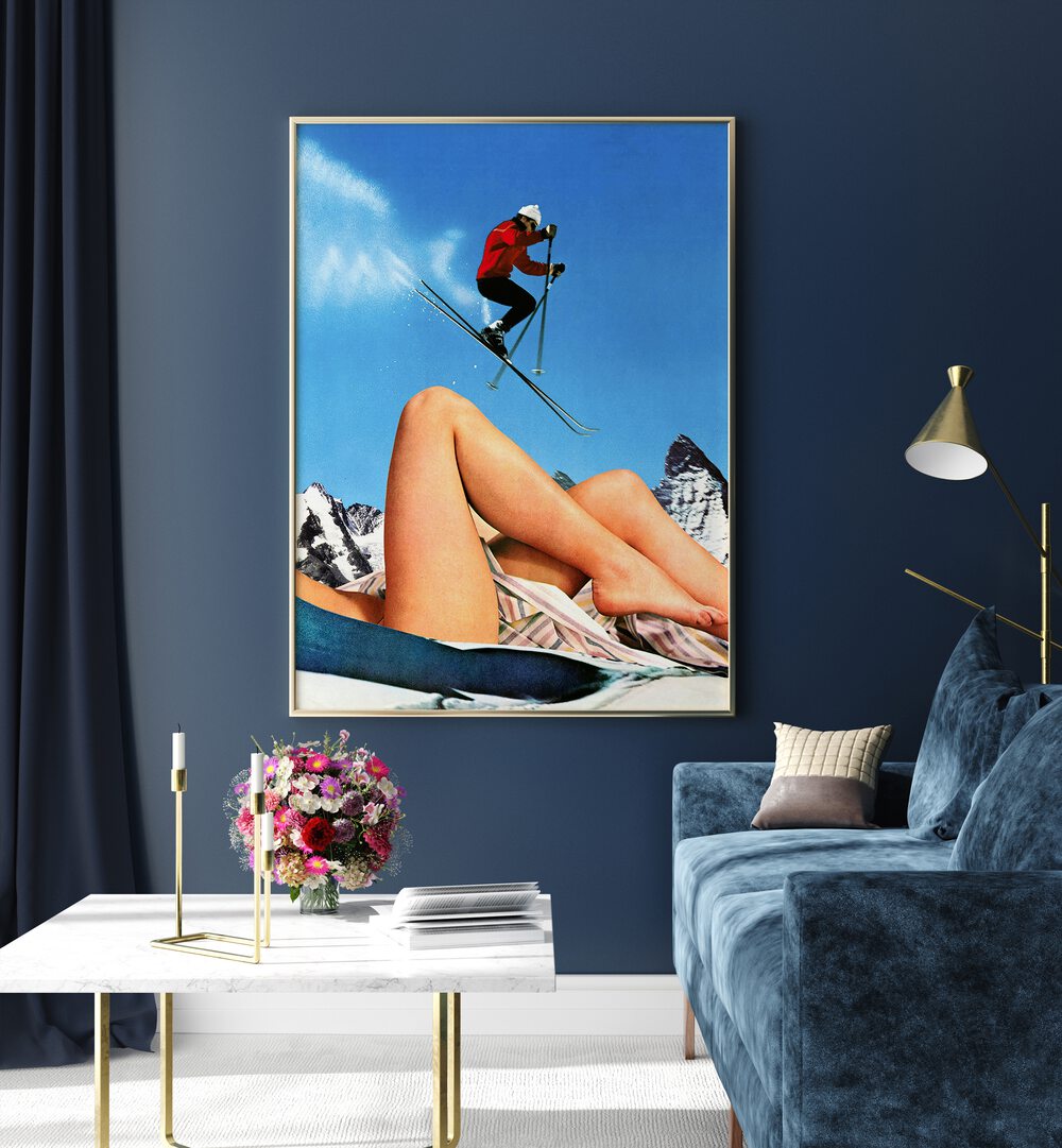The Big Jump Surreal Paintings Surreal Art Prints in Gold Plain Frame placed on a Blue Colored Wall near a Blue Sofa  in the Living Room