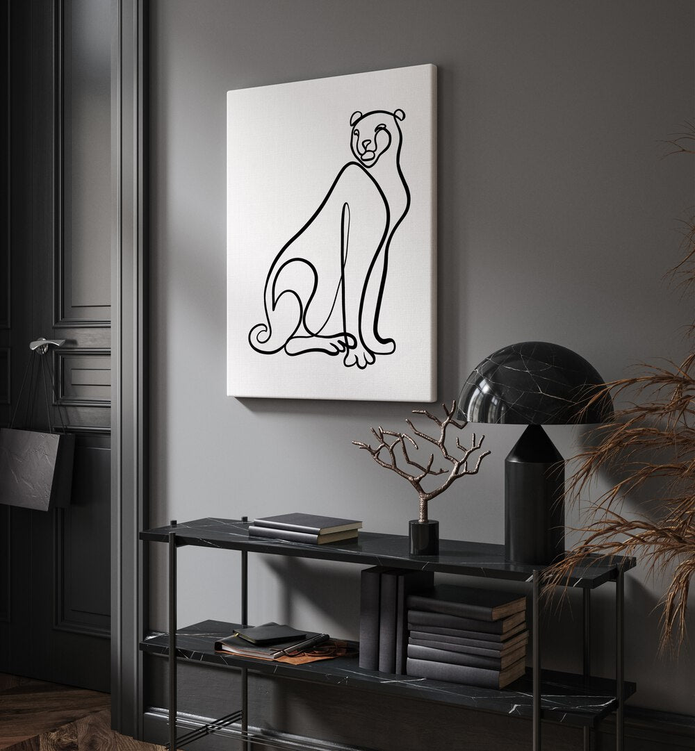 The Cheetah by Hanna Lee Tidd Line Art Paintings Line Art Prints in Gallery Wrap placed on a wall behind a table and a door