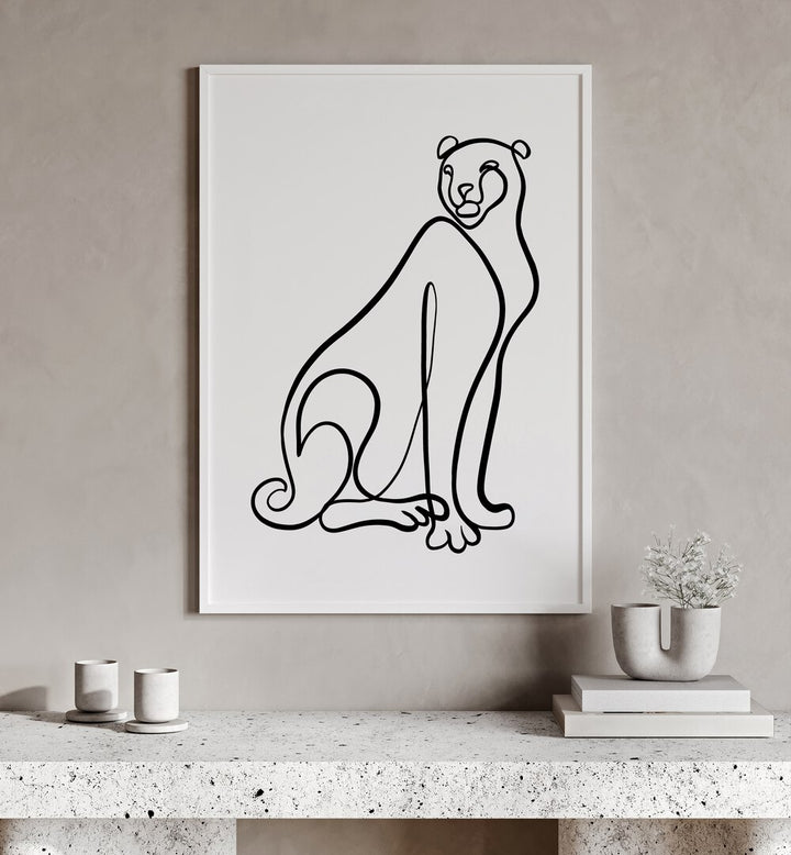 The Cheetah by Hanna Lee Tidd Line Art Paintings Line Art Prints in White Plain Frame placed on a wall behind a table