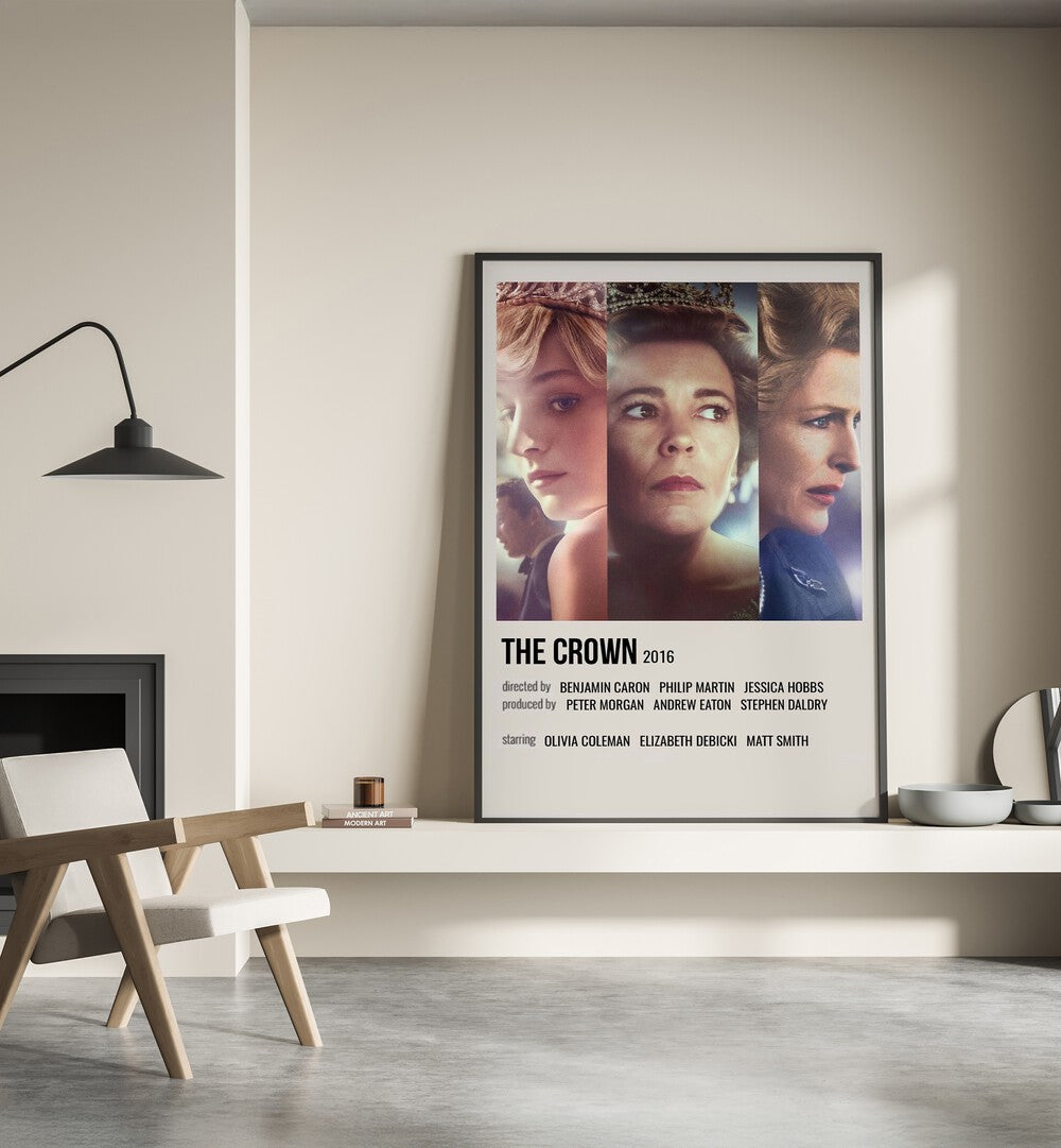 The Crown 2016 I Movie Posters in Black Plain Frame placed on a shelf beside a hearth