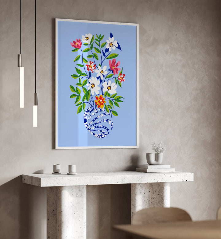 The Floopy Planter By Uma Gokhale Botanical Paintings in White Plain Frame on a wall above  a white table