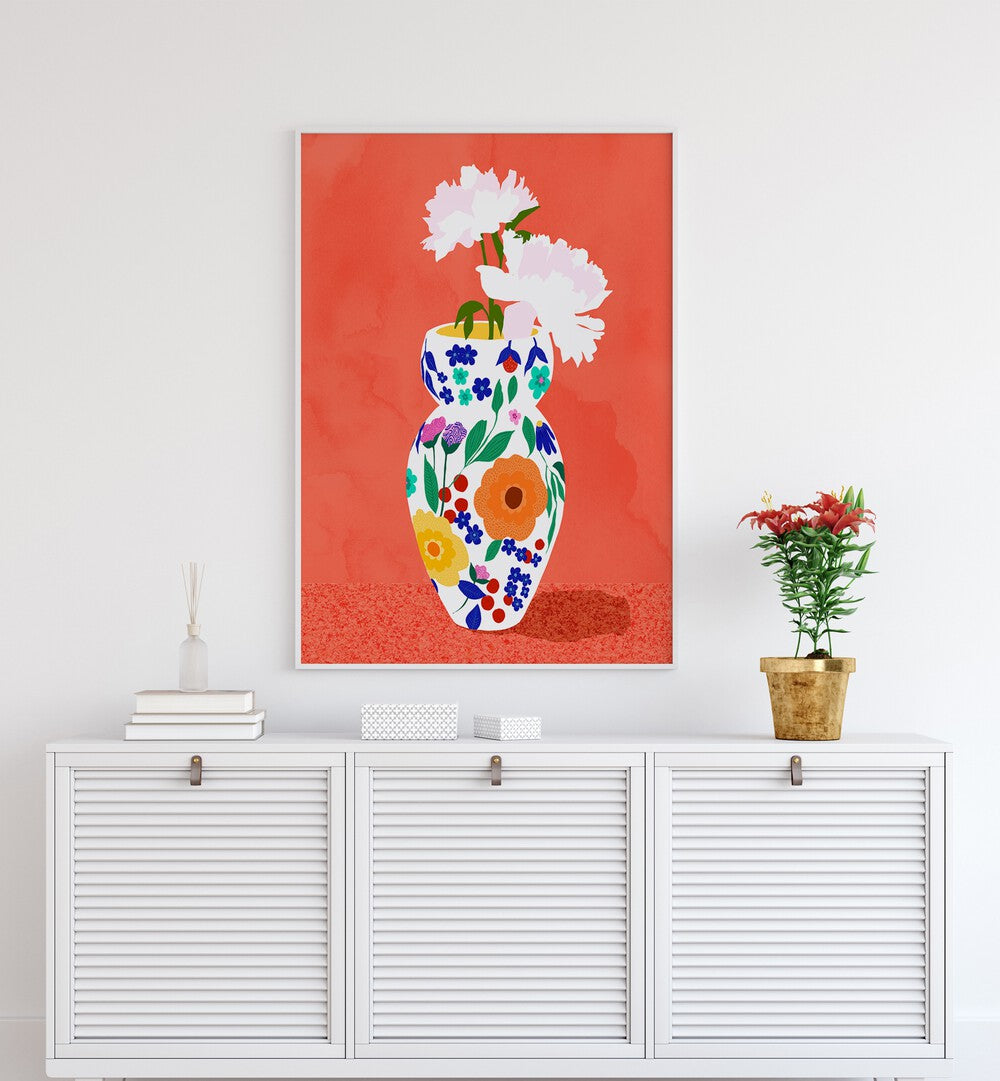 The Flower Pot By Uma Gokhale Botanical Art Prints in White Plain Frame on a wall above a white console table