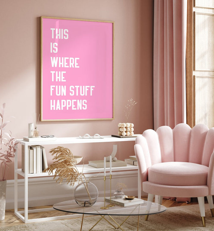 The Fun Stuff by Athene Fritsch Quotes and Typography Posters in Oak Wood Plain Frame placed on a pink wall beside a window and behind a table