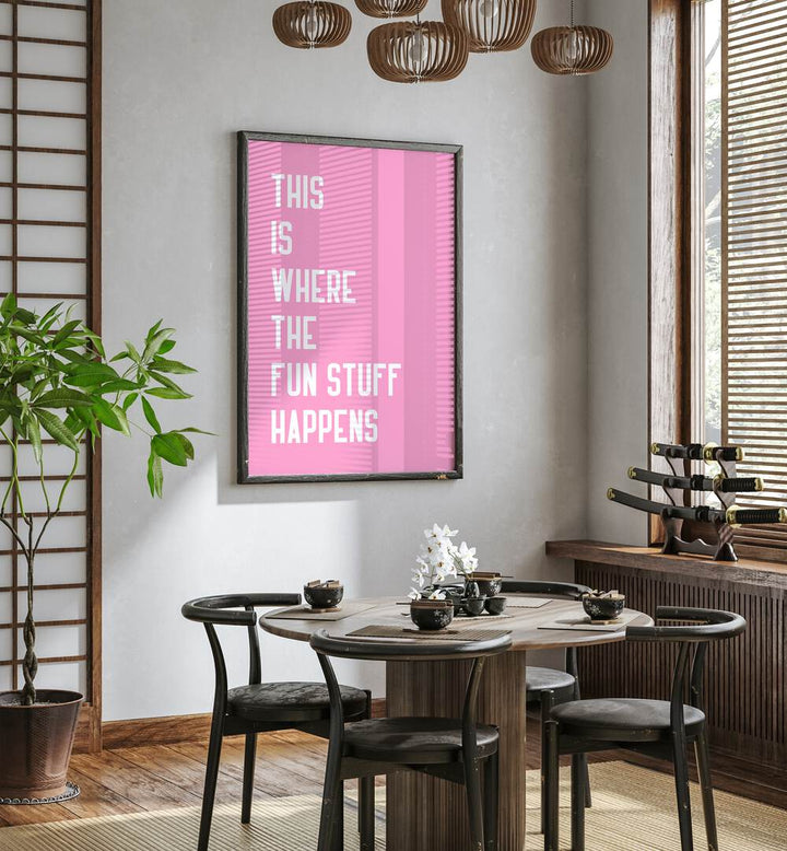 The Fun Stuff by Athene Fritsch Quotes and Typography Posters in Black Plain Frame placed on a wall in a dining room area beside a window and behind a dining table