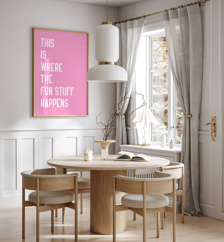 The Fun Stuff by Athene Fritsch Quotes and Typography Posters in Oak Wood Plain Frame placed on a wall in a dining room area beside a window and behind a dining table