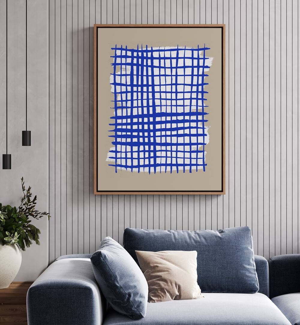 The Grid VIII By Mareike Bohmer Abstract Art Abstract Paintings in Oak Wood Floater Frame placed on a Cream Colored Wall near a Blue Sofa in the Living Room