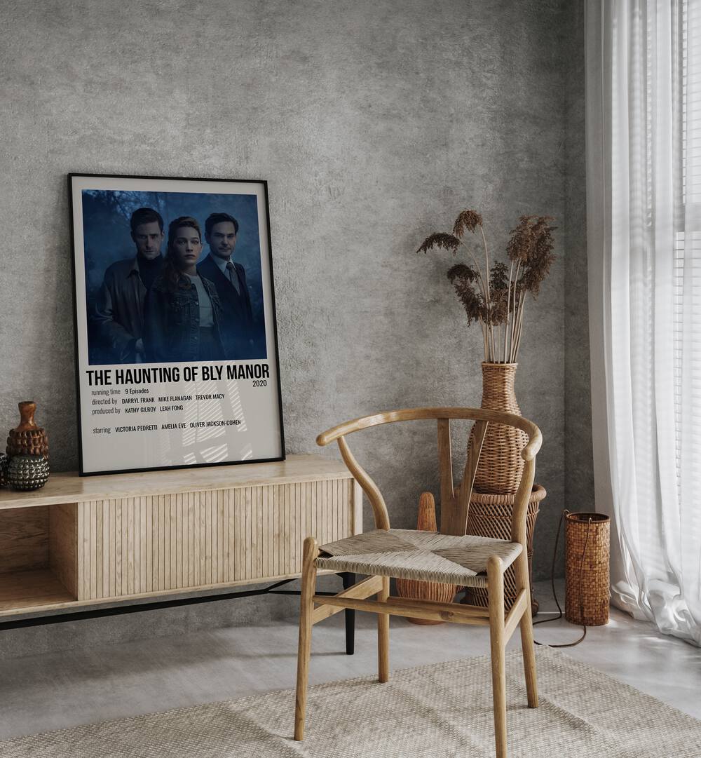 The Haunting Of Bly Manor 2020 Movie Posters in Black Plain Frame placed on a console behind a chair