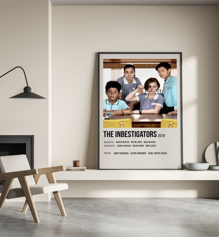 The Inbestigators 2019 Movie Posters in Black Plain Frame placed on a shelf beside a hearth