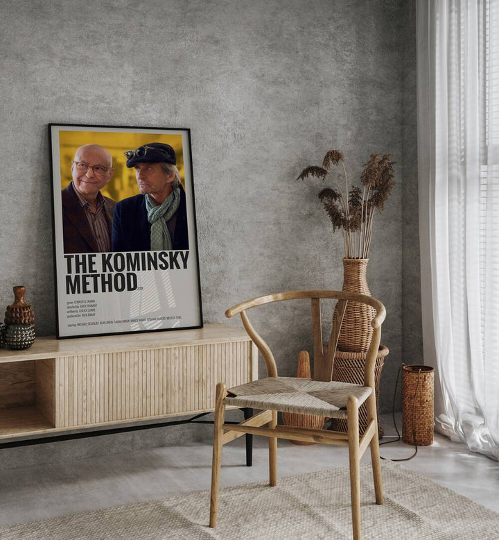 The Kominsky Method 2018 Movie Posters in Black Plain Frame placed on a console behind a chair