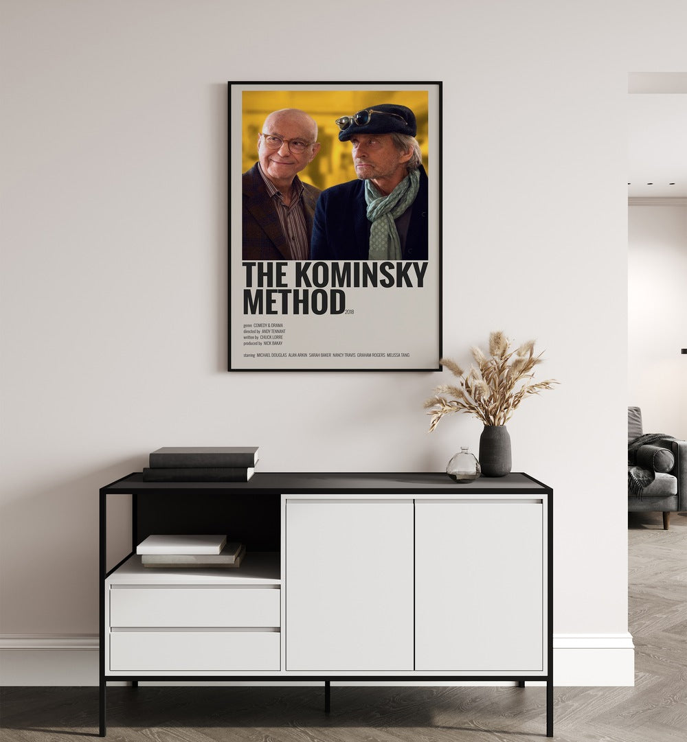 The Kominsky Method 2018 Movie Posters in Black Plain Frame placed on a white wall behind a table