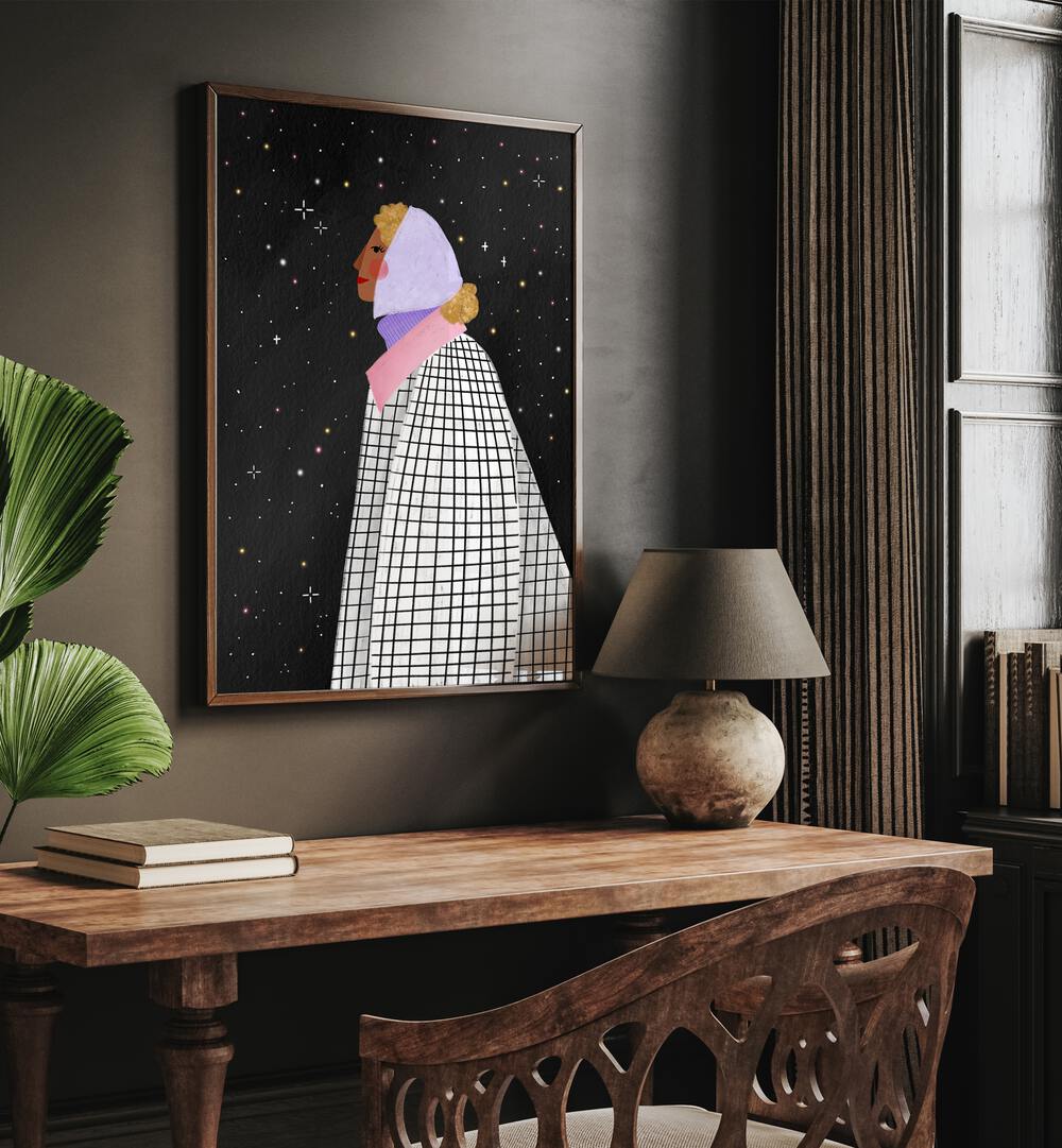 The Lady With The Stars By Bea Muller Women Illustration Paintings in Dark Wood Plain Frame on a wall above a study table beside a plant