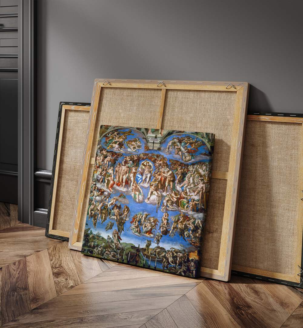 The Last Judgment 1536-1541 Vintage Paintings in Gallery Wrap placed on the floor beside canvas and a door