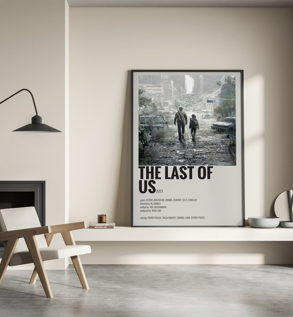 The Last Of Us 2023 Movie Posters in Black Plain Frame placed on a shelf beside a hearth