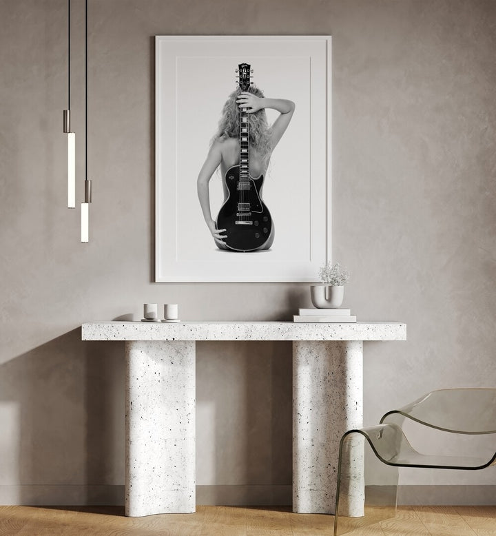 The Les Pau by David Drake Fine Art Photography Fashion Photography in White Frame With Mount placed on a wall behind a table