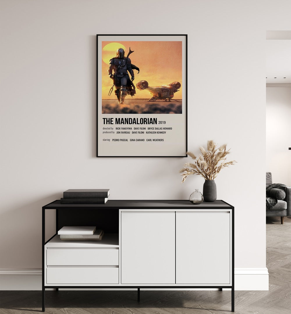 The Mandalorian 2019 i Movie Posters in Black Plain Frame placed on a white wall behind a table