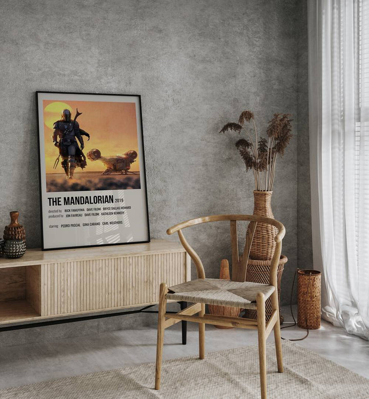 The Mandalorian 2019 i Movie Posters in Black Plain Frame placed on a console behind a chair