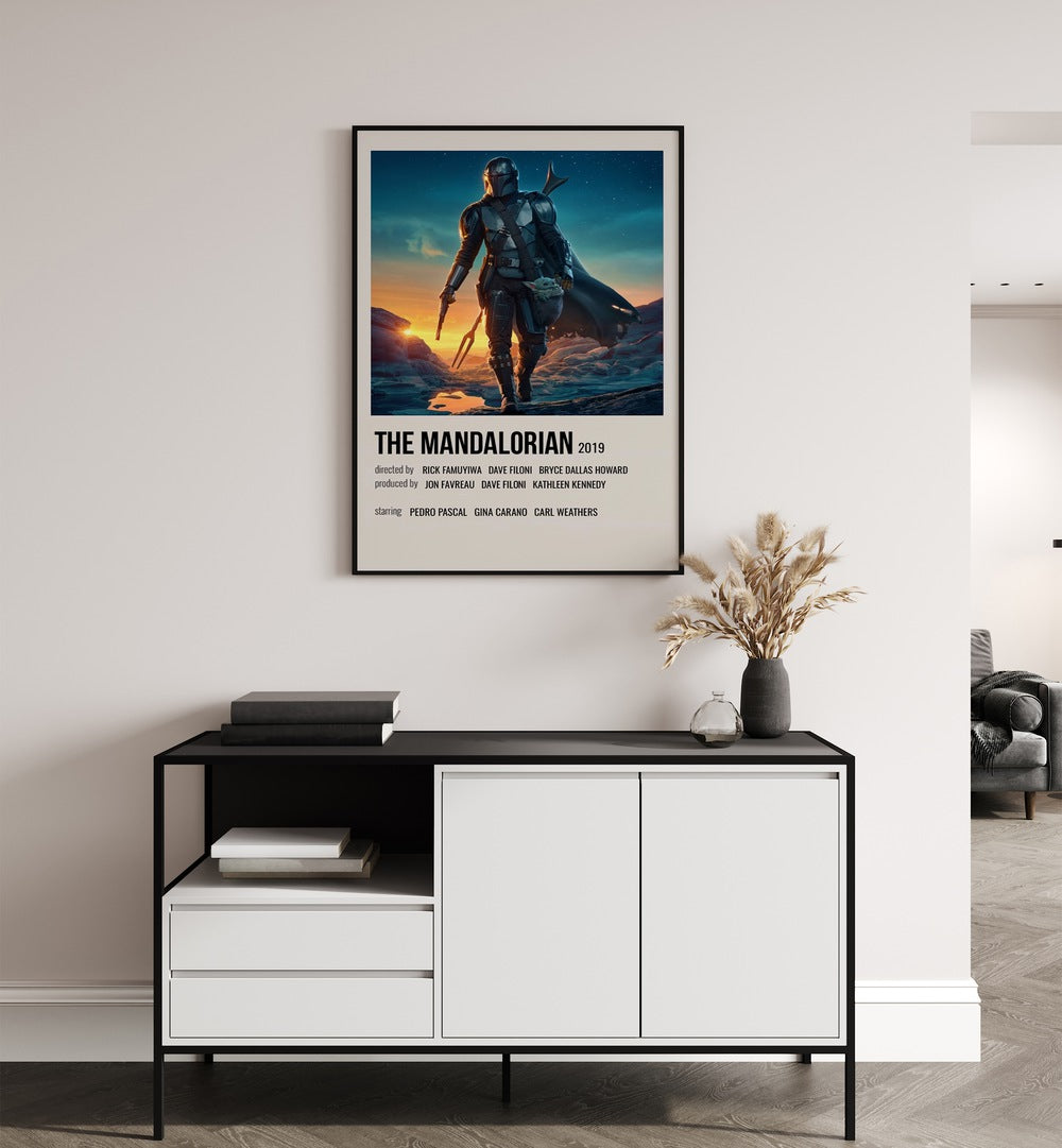 The Mandalorian 2019 ii Movie Posters in Black Plain Frame placed on a white wall behind a table