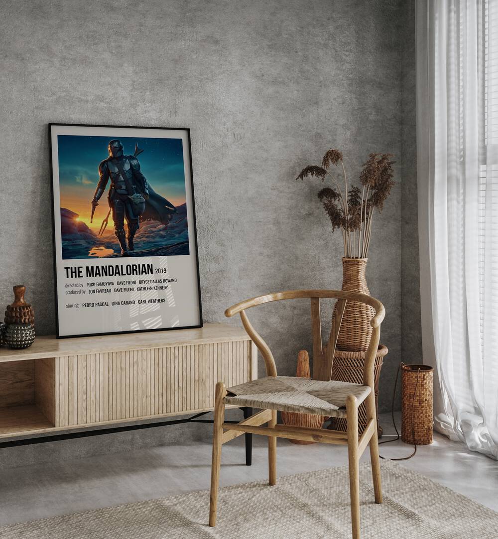 The Mandalorian 2019 ii Movie Posters in Black Plain Frame placed on a console behind a chair