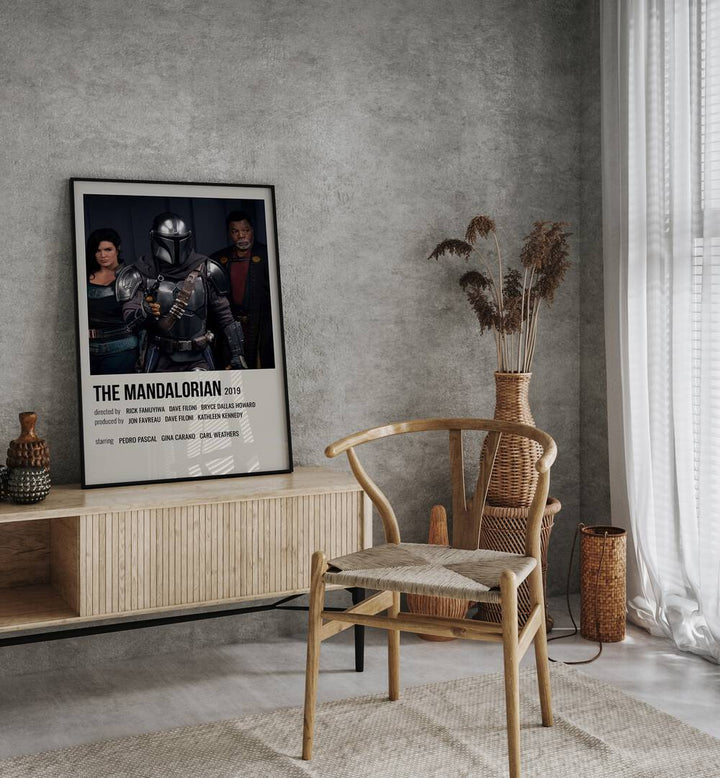 The Mandalorian 2019 iii Movie Posters in Black Plain Frame placed on a console behind a chair