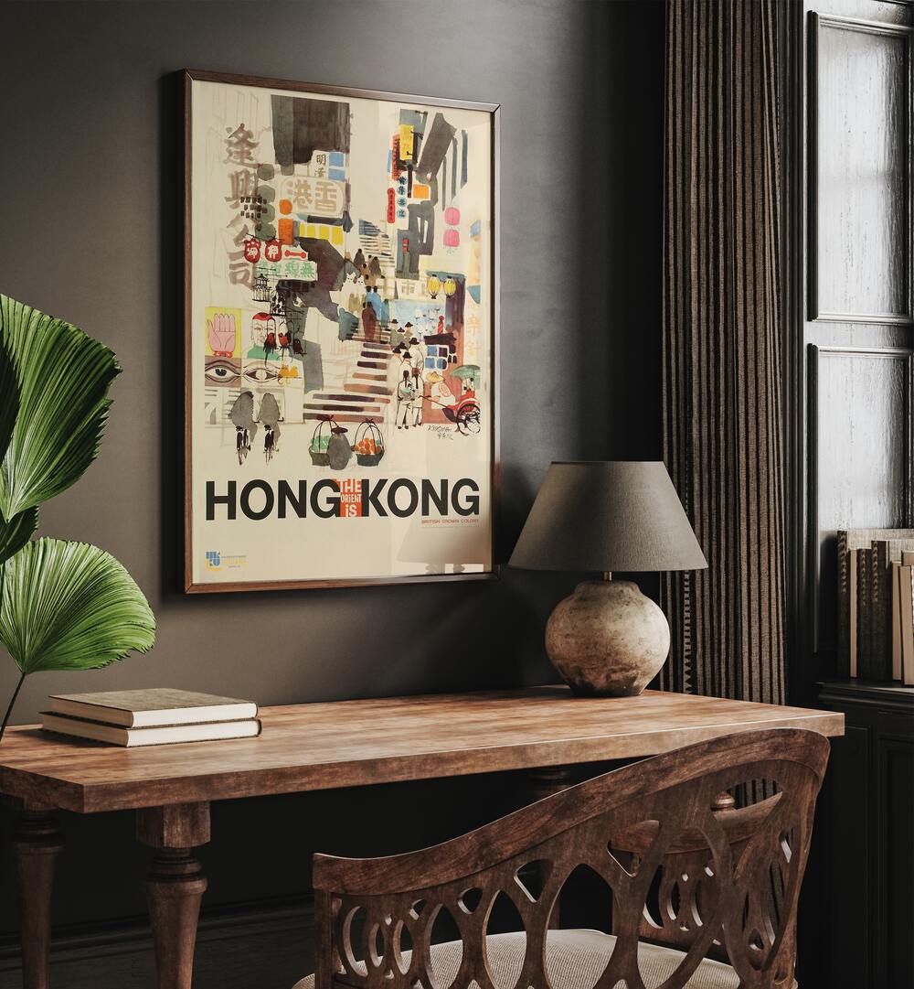 The Orient Is-hong Kong Retro Vintage Travel Travel Posters in Oak Wood Plain Frame on a wall above a study table beside a lamp