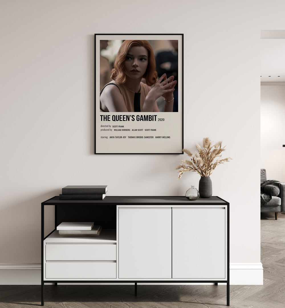 The Queens Gambit 2020 I Movie Posters in Black Plain Frame placed on a white wall behind a table