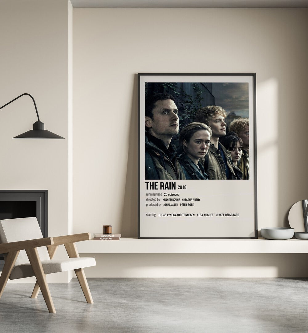 The Rain 2018 Movie Posters in Black Plain Frame placed on a shelf beside a hearth