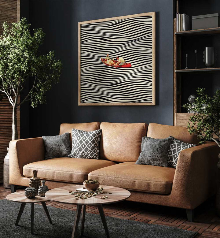 The Real Boat Trip Surreal Paintings Surreal Art Prints in Oak Wood Plain Frame placed on a Blue Colored Wall near a Brown Sofa in the Living Room